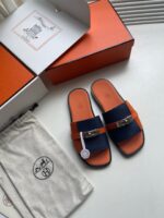 Sandali di lusso navy e arancione con scatola elegante e dust bag premium.