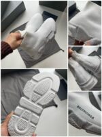 Sneakers eleganti bianche senza lacci, design moderno e dettagli di alta qualità.