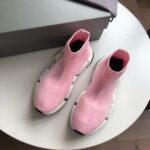 Sneakers moderni rosa e bianche, design trendy e comfort per lo stile quotidiano.