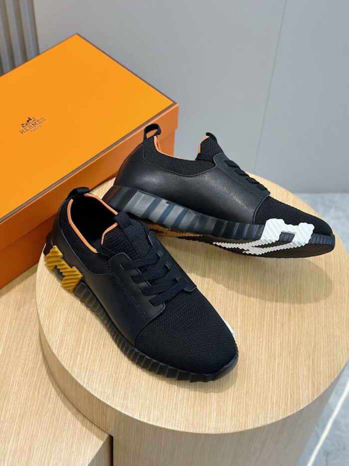 Sneakers nere di design esclusivo con dettagli colorati e scatola di lusso arancione