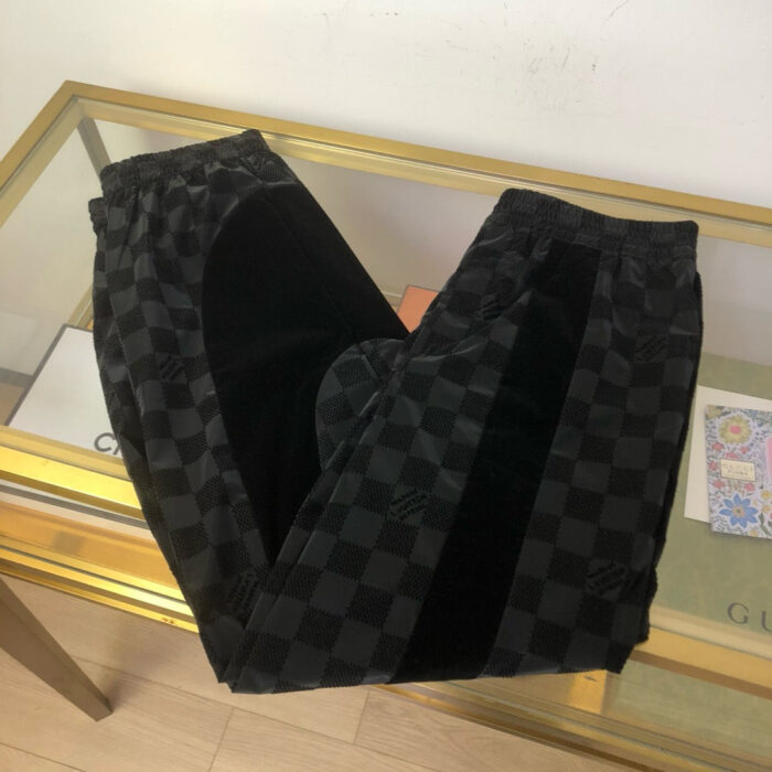 Pantaloni neri con motivo a quadri e dettaglio in tessuto vellutato, elasticizzati, eleganti e comodi