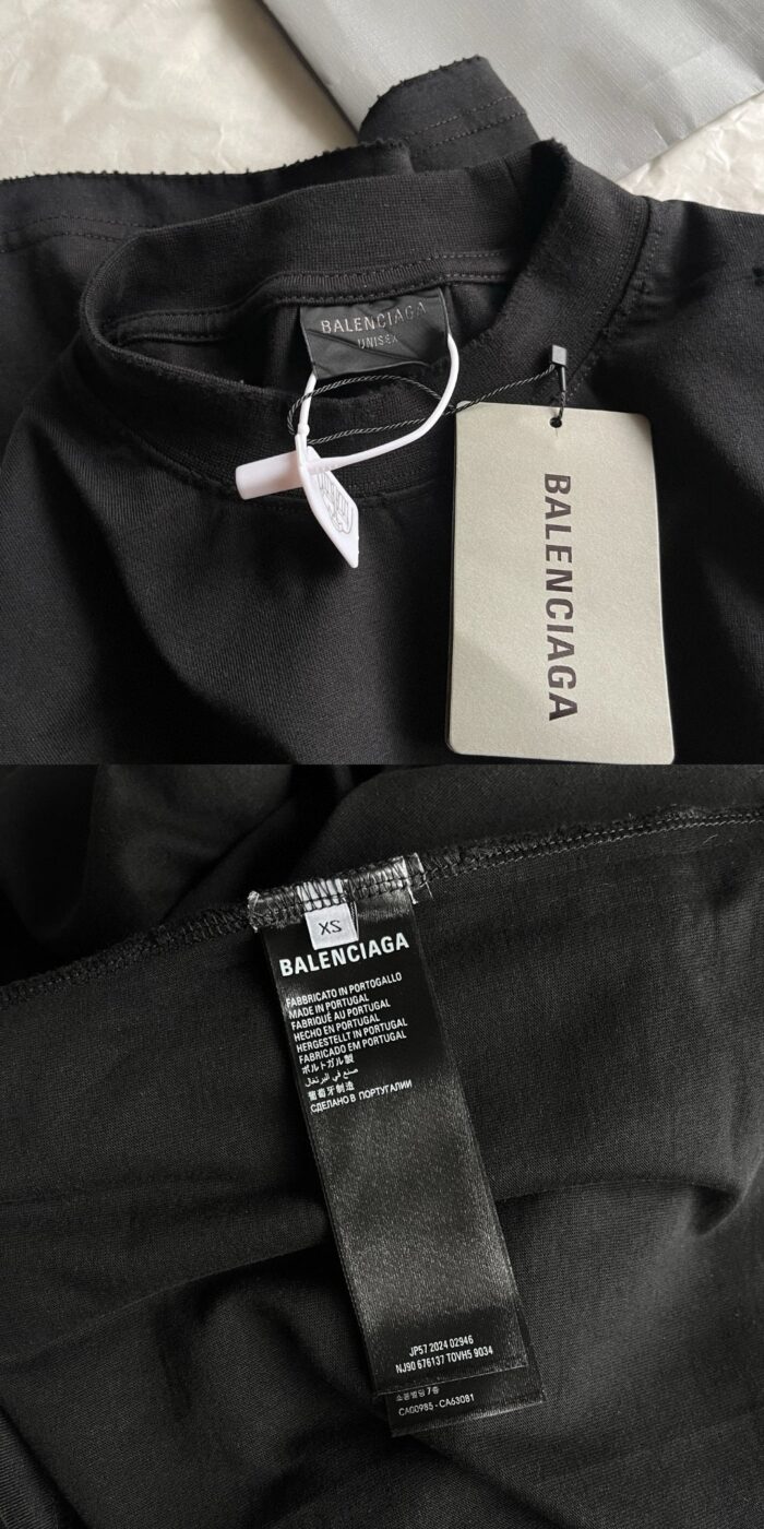 Etichetta Balenciaga su morbido top nero di lusso, dettaglio elegante e autentico.