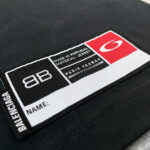 Etichetta Balenciaga in jersey, Made in Portugal, con logo e spazio per personalizzazione.