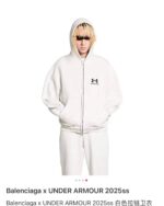 Look casual e di tendenza con hoodie Balenciaga e Under Armour, stile streetwear minimalista 2025.