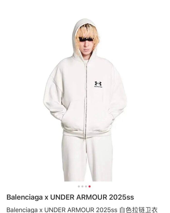 Look casual e di tendenza con hoodie Balenciaga e Under Armour, stile streetwear minimalista 2025.