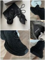 Sneakers nere di lusso con dettagli riflettenti, suola moderna e stile contemporaneo.