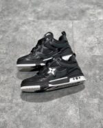 Sneakers nere alte con logo a stella e suola robusta, stile urbano e moderno.