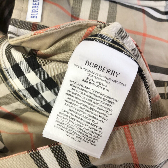 Etichetta Burberry con istruzioni di lavaggio su tessuto check classico.