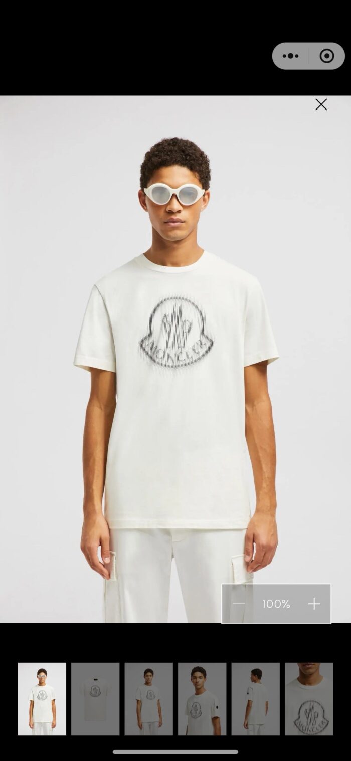 Modello uomo in stile streetwear con t-shirt grafica e sunglasses oversize elegante.