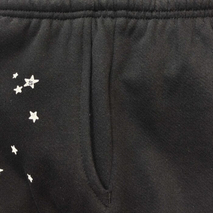 Pantaloni casual con stelle bianche, tasca funzionale e vita elasticizzata, stile giovane e comodo.