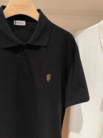Polo nere e bianche di alta qualità, stile classico ed elegante per ogni occasione.