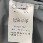 Etichetta di cura in italiano per abito in seta made in Italia, lavaggio professionale consigliato.