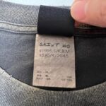 Etichetta T-Shirt Saint Mo 1995 XL, cotone 100%, istruzioni cura, interno colletto.