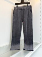 Pantaloni jogger grigi sfumati in felpa morbida con coulisse rossa e tasche laterali