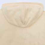 Felpa beige casual minimalista con cappuccio, morbida e versatile per uno stile semplice e confortevole.