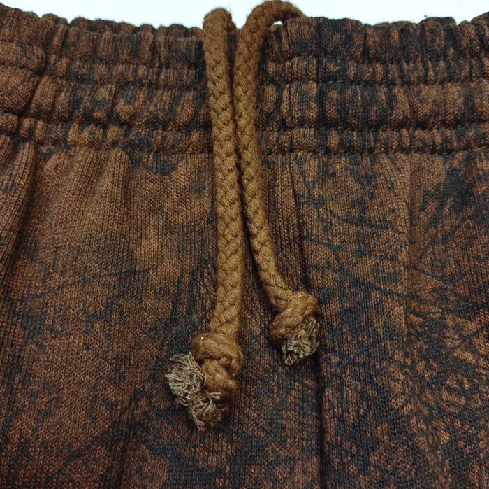 Pantaloni casual con elastico e coulisse in tessuto naturale, stile comfort e design eco-friendly.