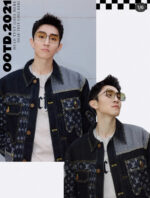 Giovane uomo con giacca denim patchwork e occhiali eleganti, stile urbano 2021.