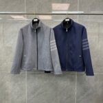 Giacca sportiva moderna grigia e navy, stile casual e comfort, ideale per attività allaperto.