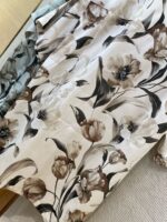 Elegant floral fabric with beige, gray, and green tones for upholstery, curtains, and décor.