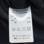 Etichetta di cura vestito 100% tessuto con istruzioni e codici prodotto