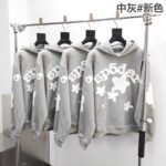 Felpe grigie con grafiche stelle, stile casual e modernes per uomo e donna.