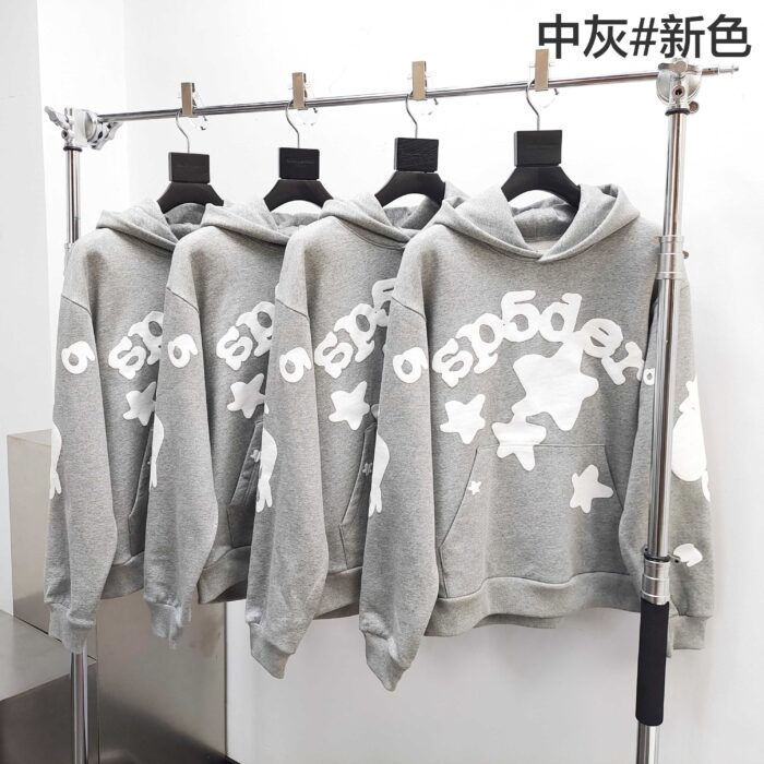 Felpe grigie con grafiche stelle, stile casual e modernes per uomo e donna.
