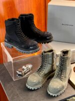 Stivali Balenciaga Rugged in nero e oliva, stile moderno, robusto e di alta qualità.