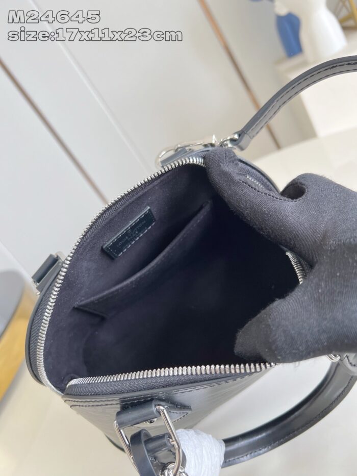 Borsa in pelle nera di alta qualità con interno minimalista e chiusura lampo elegante.