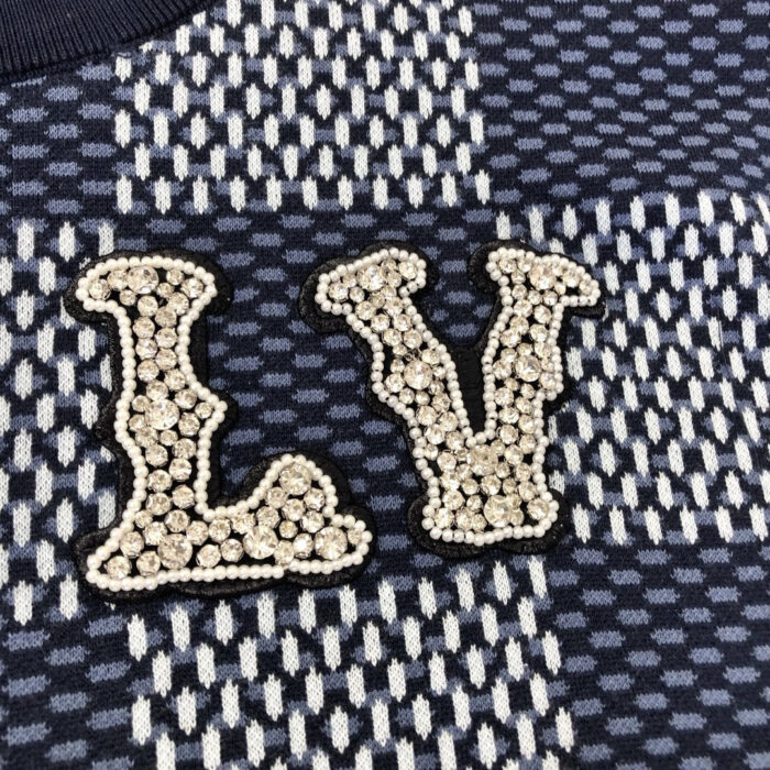 Tessuto di lusso LV con dettagli glitter e pattern moderno, elegante e raffinato.