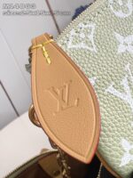 Borsa Louis Vuitton verde in pelle con dettagli oro e logo LV elegante.