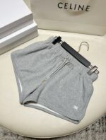 Shorts grigi di lusso con zip, stile sportivo e dettaglio moderno per un look elegante e casual.