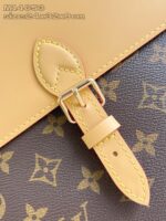 Borsa di lusso in pelle e tessuto con fibbia elegante e dettagli raffinati.
