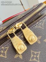 Borsa Louis Vuitton Monogram con zip in oro, dettagli di lusso e alta qualità.
