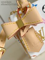 Borsa di lusso con fiocco in pelle, dettagli oro e design vivace.