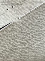 Texture di pelle resistente e elegante in tonalità chiara, perfetta per accessori di lusso.