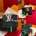 Cintura Louis Vuitton in pelle nera con fibbia doro e argento, eleganza e stile di lusso.