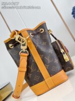 Borsa a secchiello di lusso con tracolla in cuoio e dettagli dorati elegante e versatile.