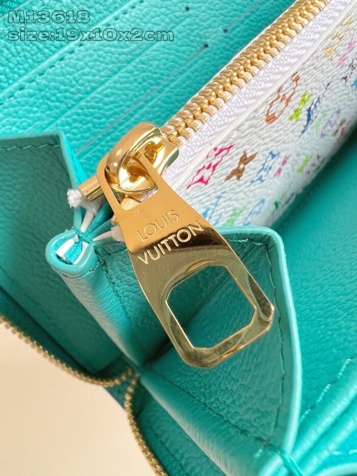 Pochette di lusso turquoise con zip oro e motivi colorati, stile elegante e vibrante.