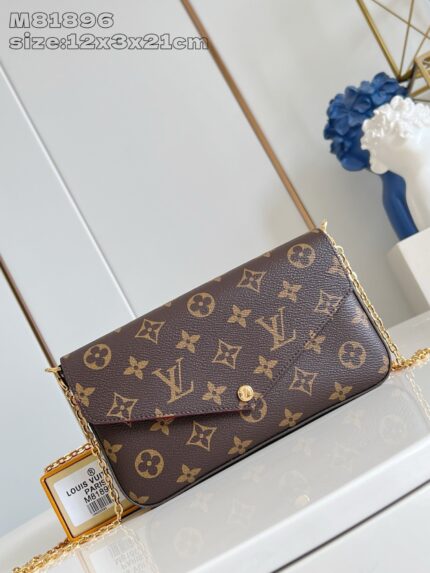 Borsa Louis Vuitton Monogram in pelle con tracolla in metallo oro, elegante e di alta qualità.