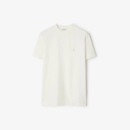 T-shirt beige minimalista con ricamo sul cuore, perfetta per look casual ed eleganti.