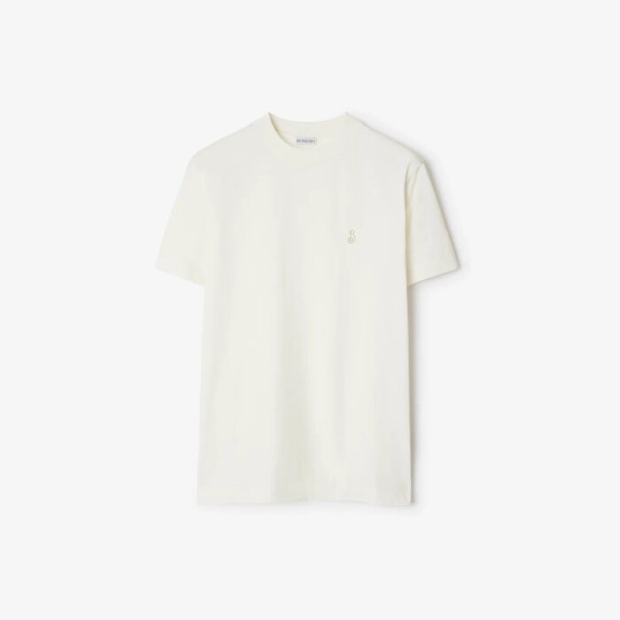 T-shirt beige minimalista con ricamo sul cuore, perfetta per look casual ed eleganti.