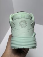 Sneaker verde menta con logo circolare, suola antiscivolo e design moderno per casual e Sport