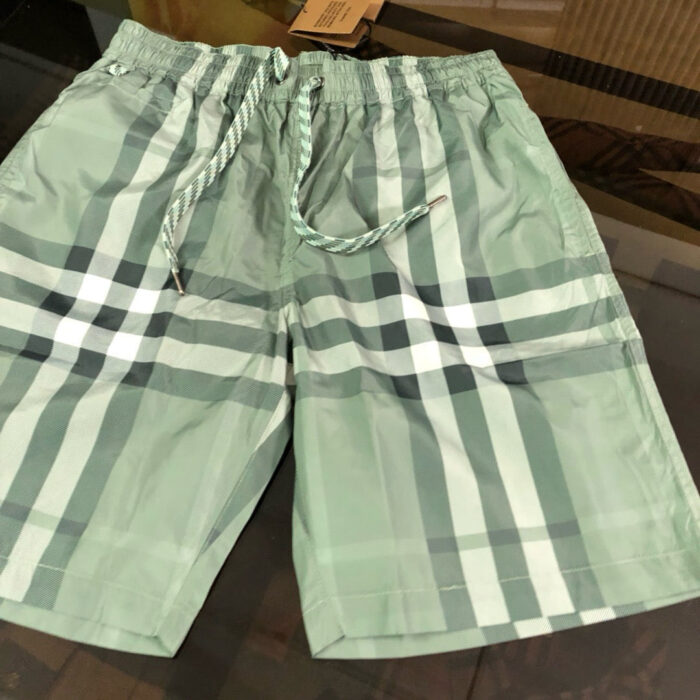 Costumi da bagno verde menta a quadri, elastico e coulisse per estate e piscina.