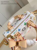 Borsa vivace con fiocco, stampa iconica, dettagli dorati e stile moderno e versatile.