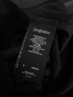 Etichetta Saint Laurent Italia di lusso con dettagli su cura, taglia e autenticità.