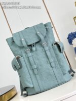 Zaino elegante in teal pastello con texture, dettagli regolabili e design moderno per ogni occasione.