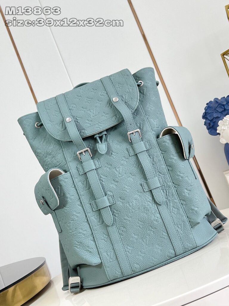 Zaino elegante in teal pastello con texture, dettagli regolabili e design moderno per ogni occasione.