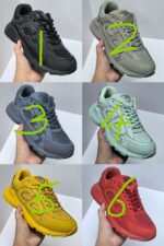 Scarpe sneakers colorate moderne, vari stili e colori, esposte su mani, perfette per ogni look.