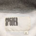 Etichetta brand SP5IDER per abbigliamento casual in taglia M.