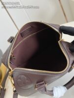 Borsa marrone elegante con tasca interna ampia e cerniera dorata, tracolla regolabile, stile moderno.